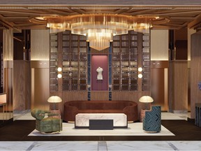 a hotel lobby with rounded sofa and art deco chandelier